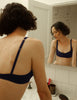 Model wearing Araks Penelope bralette in Starling
