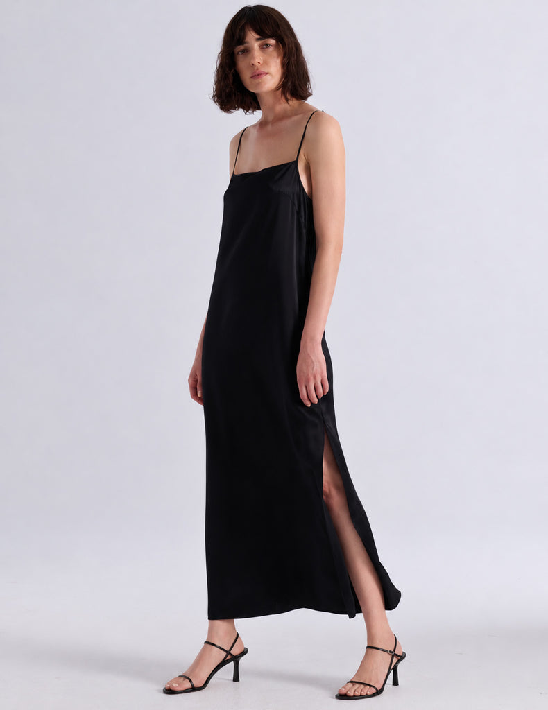 Model wearing Araks vika slip dress in black
