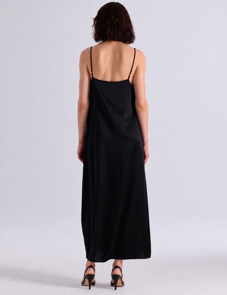Model wearing Araks vika slip dress in black