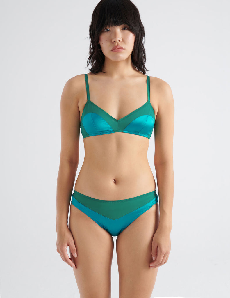 front view of woman in green silk bra and panty