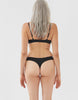 On model image of backside of black, organic cotton thong and bra. 