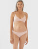 On model image of beige, organic cotton thong and bra. 