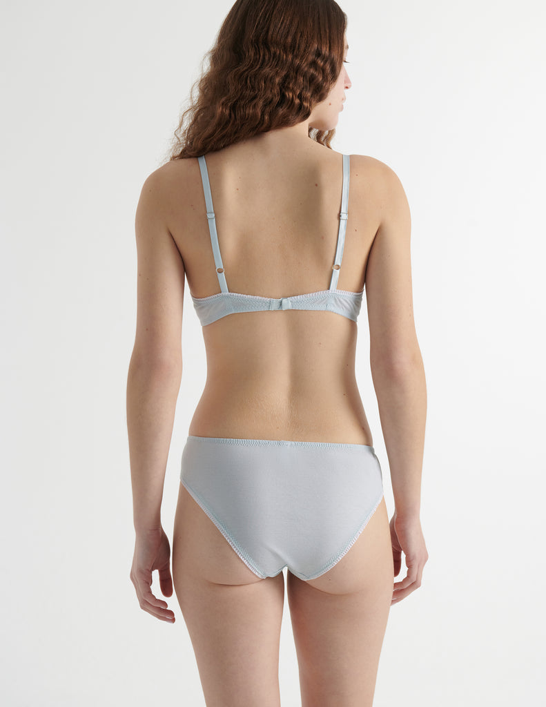 Back view of the woman wearing cloud blue cotton chloe bra with sonja panty