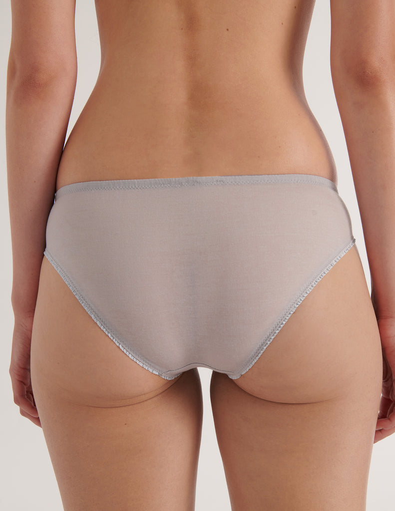 A close up image of the araks cotton crepe sonja panty in mist blue grey