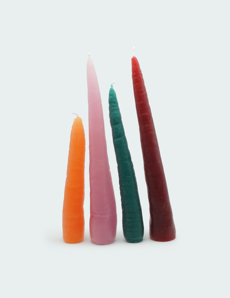 Four carrot shape candles