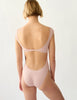 On model back view image of light pink one piece swimsuit
