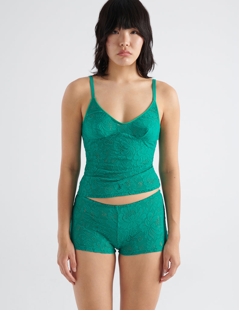 front view image of model wearing green lace cami top and boy short