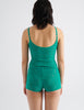 back view image of model wearing green lace cami top and boy short