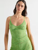 Cropped front view image of model wearing green lace cami top with matching shorts. 