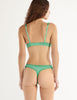 A model in the araks gita underwire bra and grier thong in cypress green