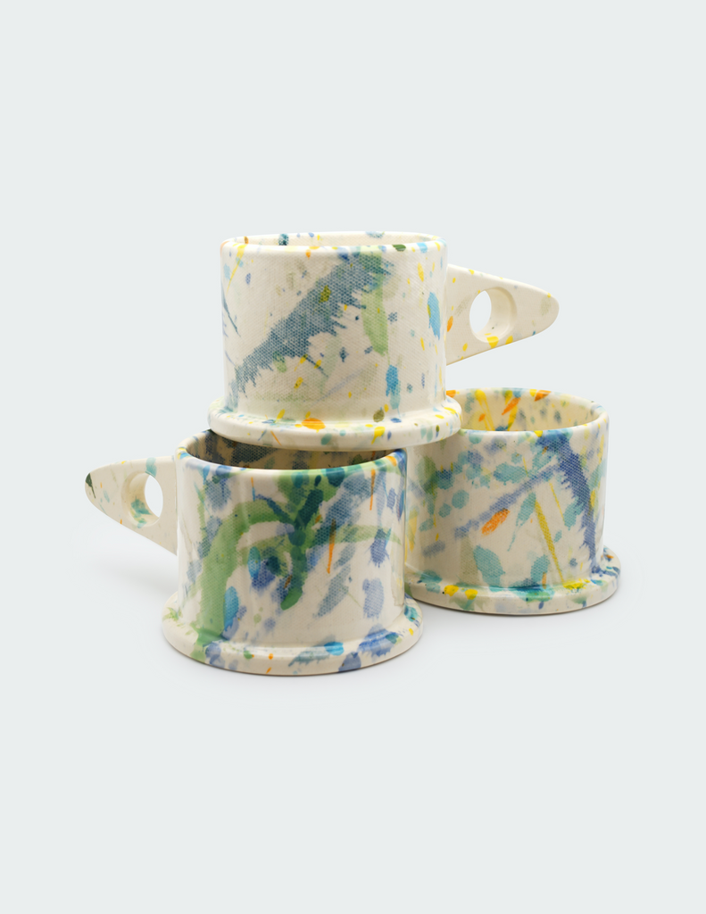 Three blue and green painted mugs