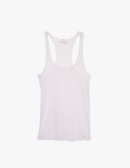 a flat lay of the kinee scalloped tank in white