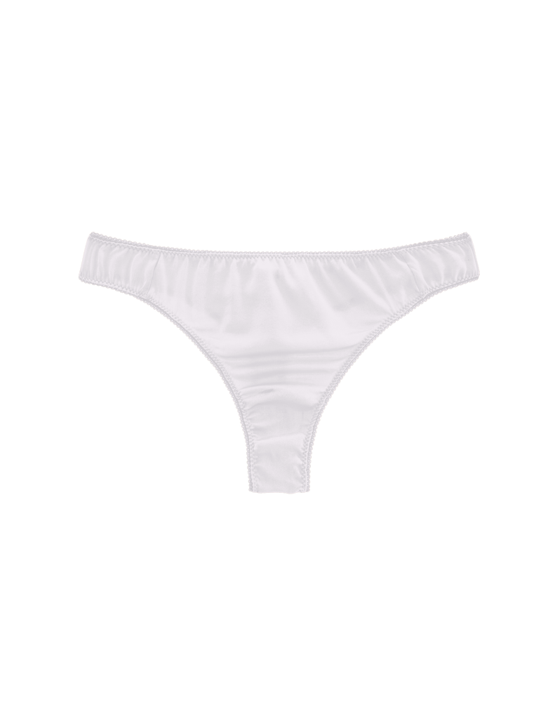 Flat of white silk thong