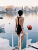 A model in the araks recycled tate one piece in black