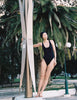 A model in the araks recycled tate one piece in black