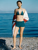 A model in the araks nelle bikini top and polly short in fern green