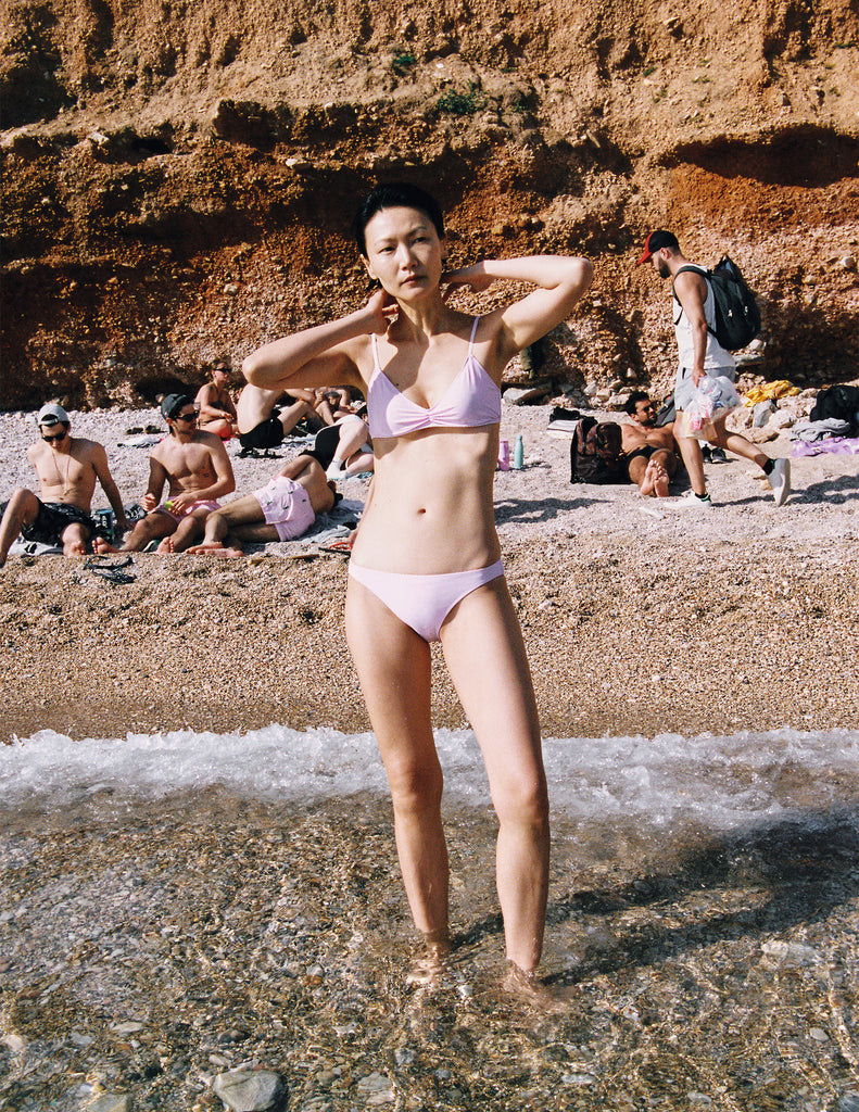 A model in the Araks tessa bikini top and piper bikini bottom in ballet pink
