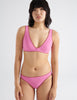 On model image of pink bikini top and bottom 