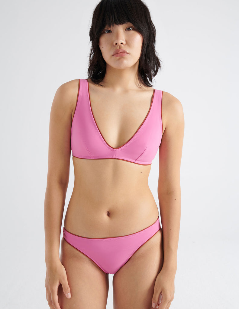 On model image of the pink bikini top and bottom 