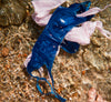 Blue and pink lingerie sets in water.