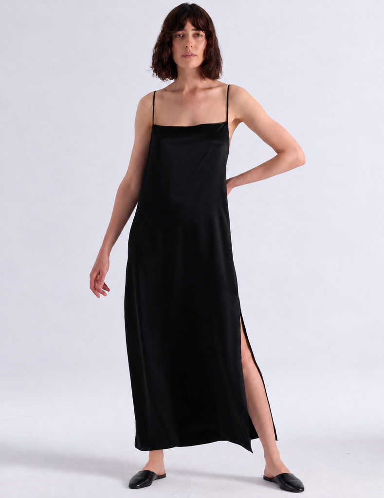 Model wearing Araks vika slip dress in black