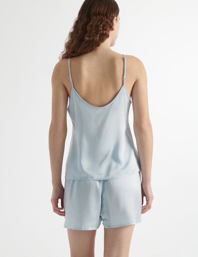 Back view of the woman wearing cloud blue parker cami silk top with eduardo boxer