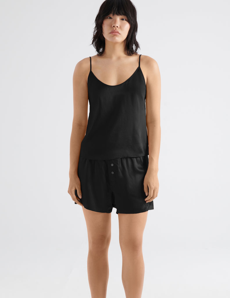 on model image of woman in black silk cami and short 