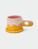 A pink and orange double dip mug by peter shire hand painted and sculpted