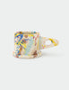 Colorful splatter-patterned Peter Shire mug on a white background