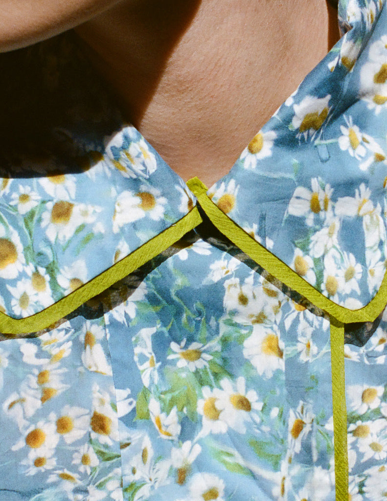 A model in the araks shelby pajama top in daisy