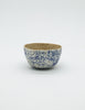 A small blue speckled bowl by Lisa Kaye
