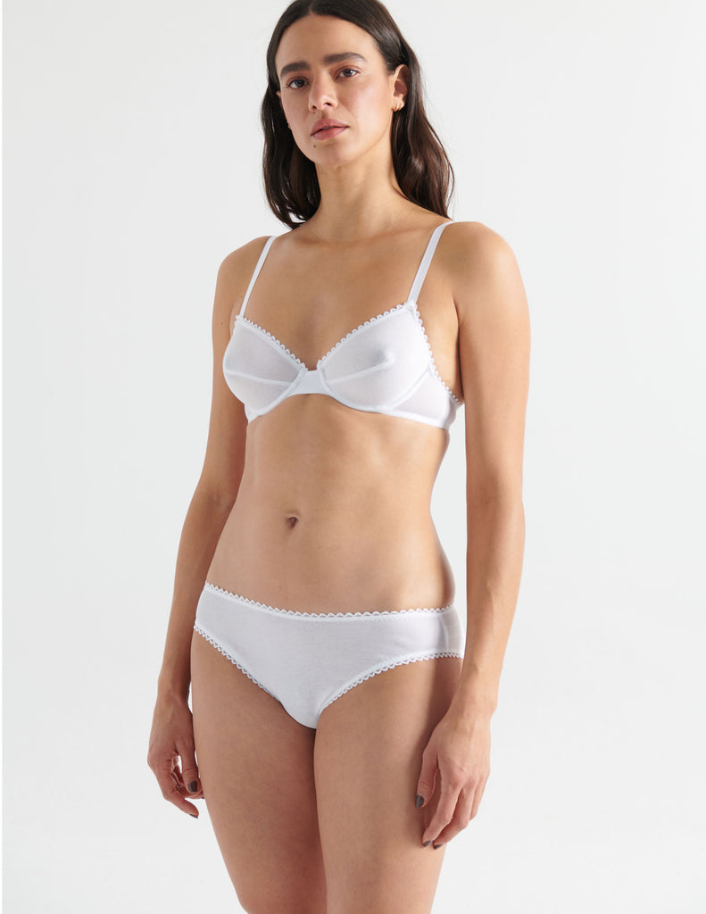Front view image of model wearing white cotton underwire bra with white trim with matching panty. 
