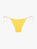 Yellow bikini bottom with white straps on a white background