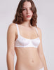 front view of woman wearing white silk bra and panty 