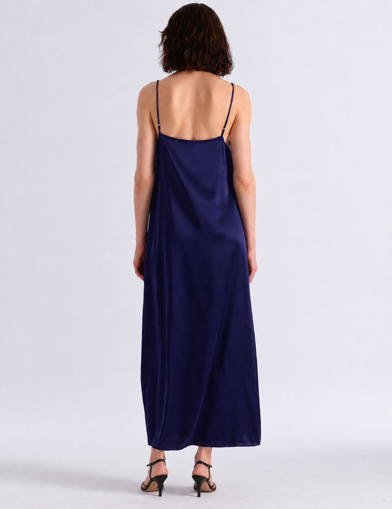 Model wearing Araks vika slip dress in starling