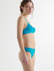 woman in blue Tamara lace bralette and Tine thong