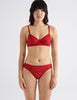 front view image of model wearing red lace bralette and panty