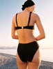 Model wearing Araks Ulija bikini top and Tonne bikini bottoms in black