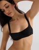 Model wearing Araks Ulija bikini top and Piper bikini bottoms in black