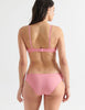 back of woman in pink cotton bralette and panty