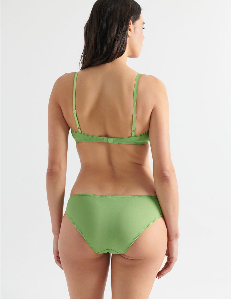 Back of Woman in Green cotton bralette with aqua silk