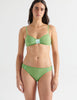 Woman in Green cotton bralette and panty with aqua silk