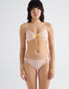 front view of woman wearing peach cotton bra and panty