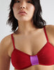 detail image of red bralette with fuchsia detail