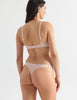 Back of Woman in Beige Cotton bralette and silk thong