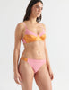 Woman in Pink cotton and orange silk bralette and  thong