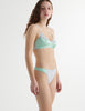 Side view of the model wearing cloud blue cotton willow bra with maude thong