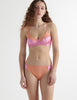Front view of the model wearing lush orange silk willow bra with saffi panty