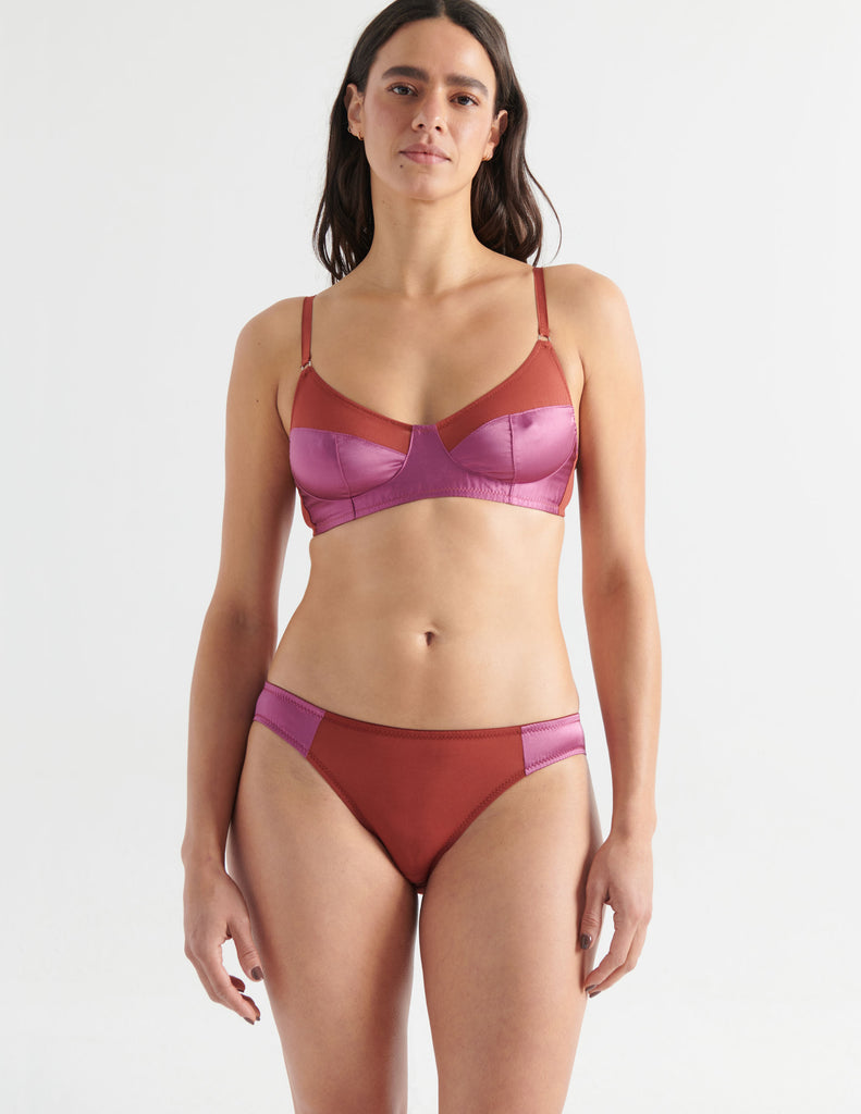 Woman in brown and pink silk bralette and panty