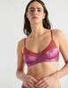 Woman in brown and pink silk bralette